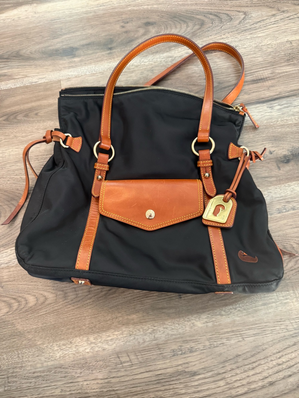 Dooney & Bourke Black and Tan Bag with Leather Trim and Pink Interior